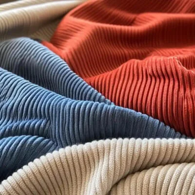 Corduroy fabric featuring ribbed texture for durable apparel manufacturing by Hesson Apparel