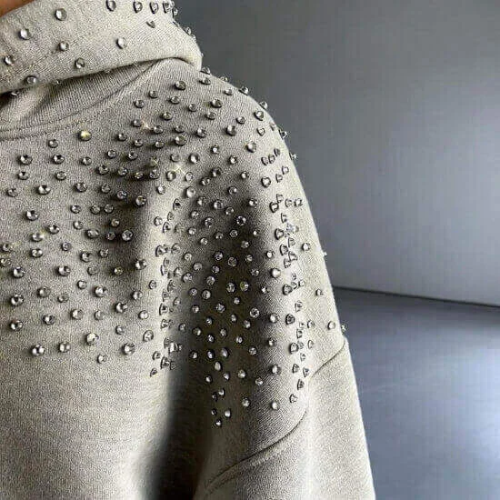 Rhinestone embellishment adding decorative sparkle and detail to apparel by Hesson Apparel