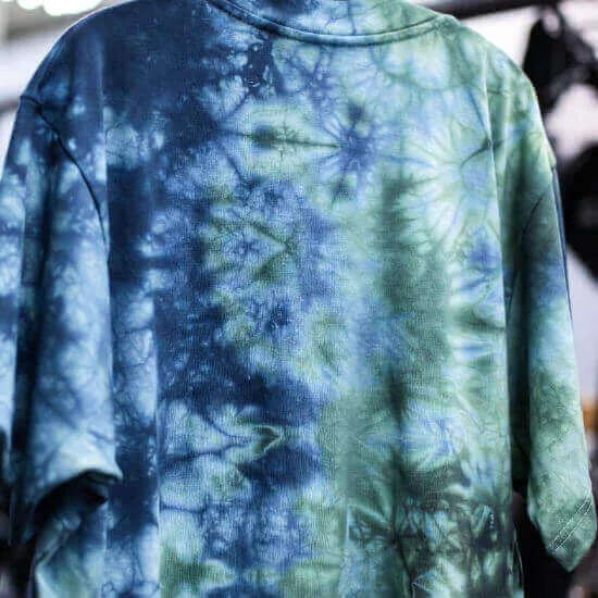 Tie-dye fabric finish creating unique color patterns on apparel by Hesson Apparel