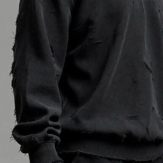 Distressed finish adding intentional wear and vintage character to garments by Hesson Apparel