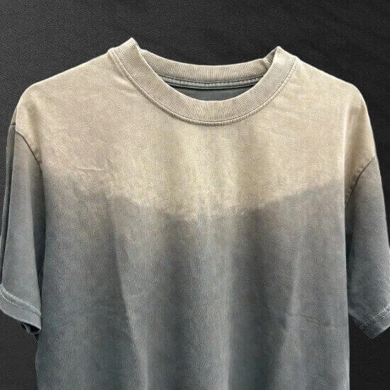 Sun fade wash creating naturally faded color tones on apparel by Hesson Apparel